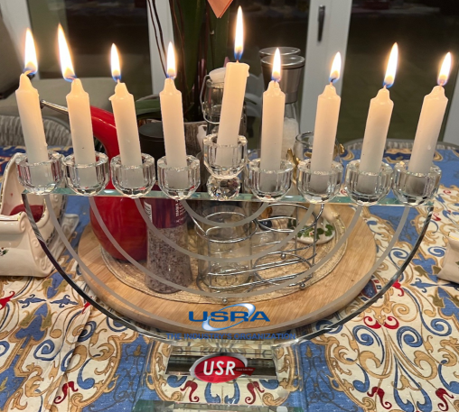 usra, chanukah menorah with all 9 candles lit, usra and usr logos